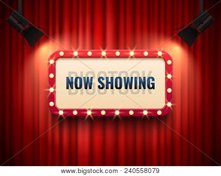 Retro Cinema Or Theater Frame Illuminated By Spotlight. Now Showing Sign On Red Curtain Backdrop. Vi