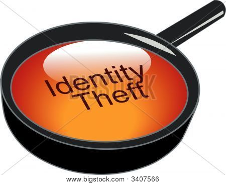 Magnifying Glass Over Identity Theft Button.