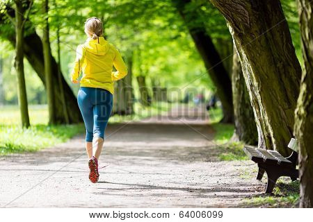 Woman Runner Running Jogging In Summer Park