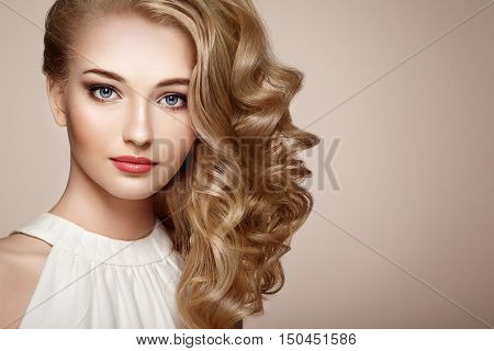 Fashion Portrait Of Young Beautiful Woman With Elegant Hairstyle