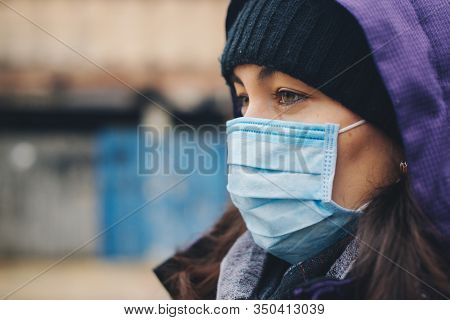 Woman Wears Protective Mask Outdoor. Mask Against Infectious Diseases And Flu. Health Care Concept. 