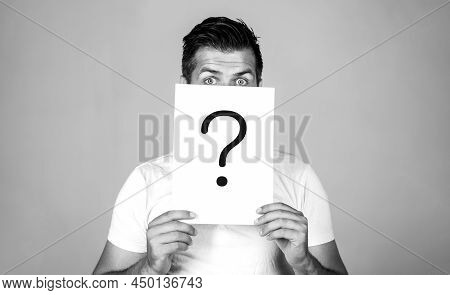 Question Mark, Symbol. Pensive Male. Man A Question. Doubtful Man Holding Question Mark. Problems An