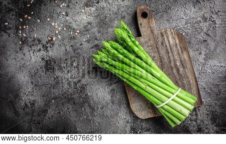 Asparagus. Bunch Of Fresh Asparagus. Banches Of Fresh Green Asparagus On Dark Background, Pickled Gr