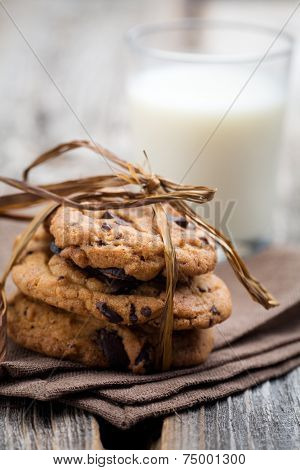 Pile of delicious chocolate chip cookies on table