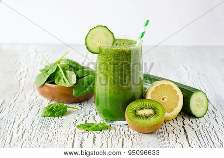 Green fresh healthy detox smoothie with spinach, cucmber, kiwi. Vitamin drink