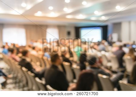 Blurry Background Speaker On Conference Stage With Projector In America