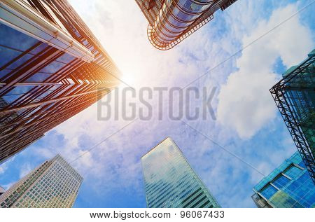 Common modern business skyscrapers, high-rise buildings, architecture raising to the sky, sun. Concepts of financial, economics, future etc.