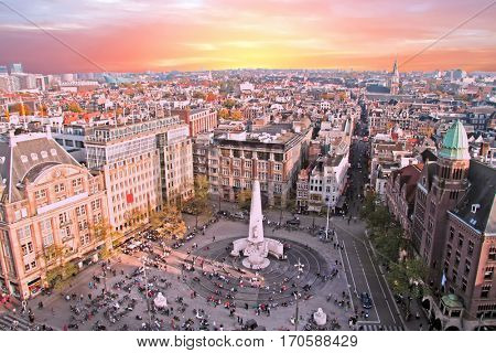 City scenic from Amsterdam with the Dam in the Netherlands at sunset