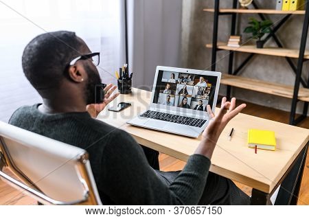 Virtual Meeting With Many People Together. African-american Young Guy Talking Online With Employees 