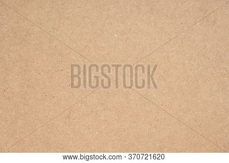 Texture of brown craft or kraft paper background, cardboard sheet, recycle paper, copy space for tex