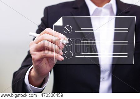 Businessman Working On A Digital Document On A Virtual Screen Using A Stylus Pen. Concept Of Technol