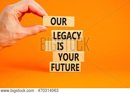 Legacy And Future Symbol. Concept Words Our Legacy Is Your Future On Wooden Blocks. Beautiful Orange