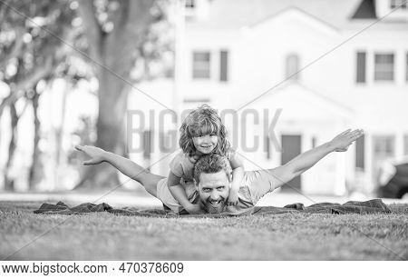 Happy Dad Having Fun With Kid Relax Together On Green Park Grass, Best Friend