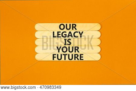 Legacy And Future Symbol. Concept Words Our Legacy Is Your Future On Wooden Stick. Beautiful Orange 