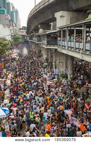 Bangkok, Thailand - April 13, 2014 : The Songkran festival or Thai New Year's festival on Silom street in Bangkok, Thailand.