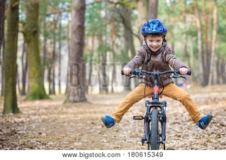 Happy Kid Boy Of 3 Or 5 Years Having Fun In Autumn Forest With A Bicycle On Beautiful Fall Day. Acti