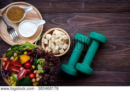 Diet Healthy Food And Lifestyle Health Concept. Sport Exercise Equipment Workout and gym With Nutrit