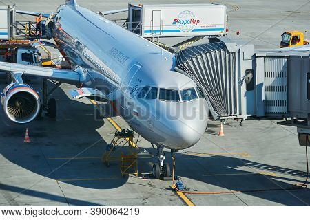 Moscow, Russia - September 16, 2020: Boarding Passengers On A Plane Using A Jet Bridge At Sheremetye