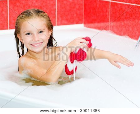 Little girl in the bath with a red wisp