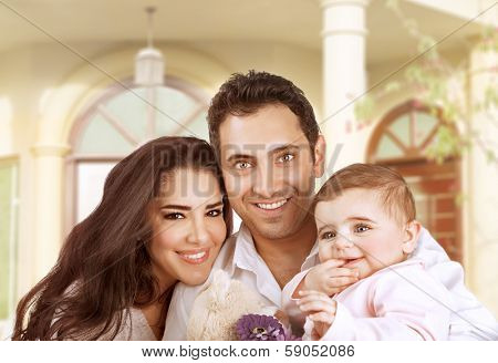 New family house, successful young parents with little baby having fun in country house, young cheerful owner of real estate, happy lifestyle concept 