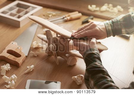 Craftsman Building A Wooden Toy Airplane