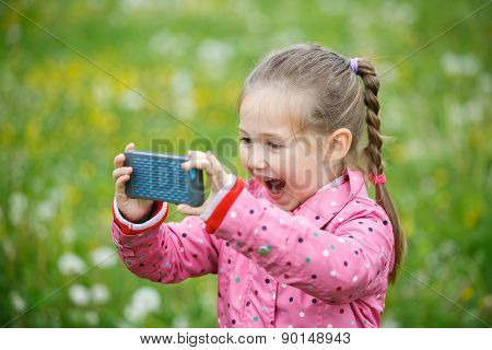 Little Girl Photographing With Her Smartphone