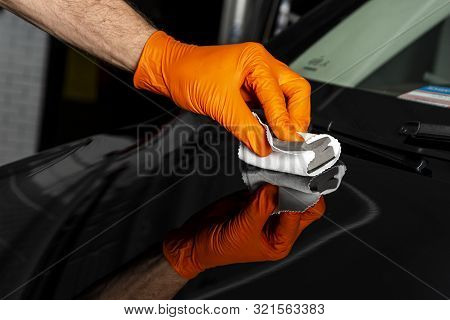 Car Polish Wax Worker Hands Polishing Car. Buffing And Polishing Vehicle With Ceramic. Car Detailing