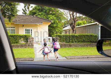 Happy Father With Kids In Front Of House