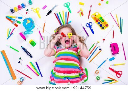 Littel Girl With School Supplies