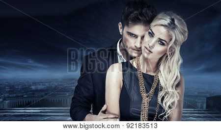 Elegant fashion couple over city background