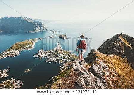 Man Traveler Hiking On Reinebringen Mountain Ridge In Norway Lifestyle Adventure Traveling Outdoor S