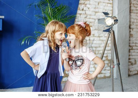 Two Little Funny Children Sing A Song In A Microphone. Group. The Concept Is Childhood, Lifestyle, M