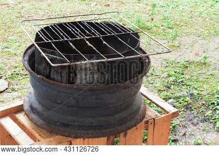 Old Grill Made With A Car Wheel And Aluminum Pan - Brazilian