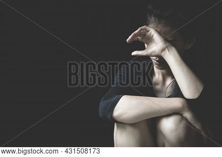 Depressed Woman Sitting On The Floor. Scared, Lonely, Depressed, Abused. Depressed Woman. Sexual Har