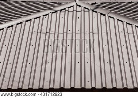 Metal Roof Covering Of The House Iron Structure And Architecture Texture Background.