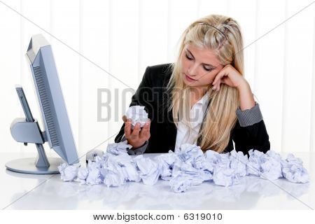 Woman Surrounded By Crumpled Paper