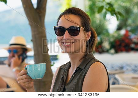 Woman Drinking Espresso Coffee At Beach Bar In Vacation. Woman Relaxing In Bar In Vacation. Vacation