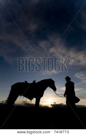 Man And Horse In Sunset