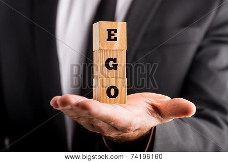 Businessman Holding Wooden Alphabet Blocks Reading - Ego