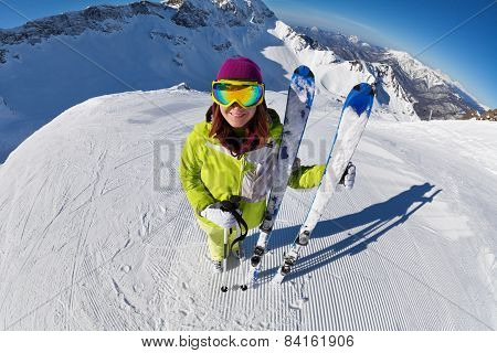 View of woman in mask standing and holding ski