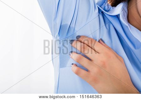 Close-up Of Young Woman Notices Her Sweat Under Armpit