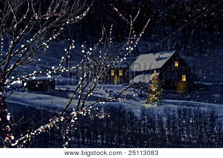 Snowy winter scene of a cabin in distance at night