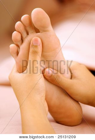 reflexology foot massage, spa foot treatment.