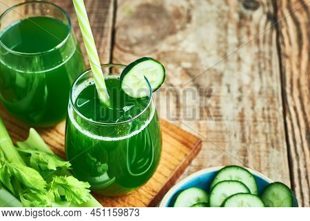 Fresh healthy green cucumber juice served in glass  for diet and detox.Cucumber juice detox. Green cucumber juice detox diet. Diet cucumber vegetable juice. Green Cucumber juice. Green detox diet juice. Green vegie cucumber juice detox.