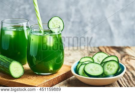 Fresh healthy green cucumber juice served in glass  for diet and detox.Cucumber juice detox. Green cucumber juice detox diet. Diet cucumber vegetable juice. Green Cucumber juice. Green detox diet juice. Green vegie cucumber juice detox.