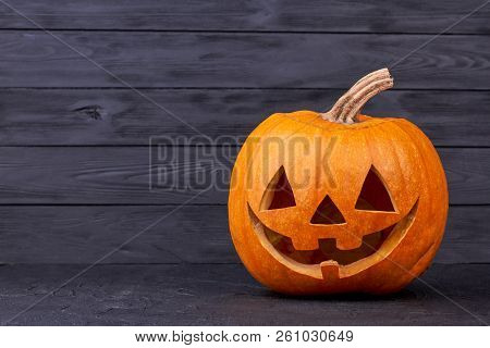 Halloween Pumpkin With Happy Expression. Halloween Pumpkin Head With Smile On Black Background, Copy