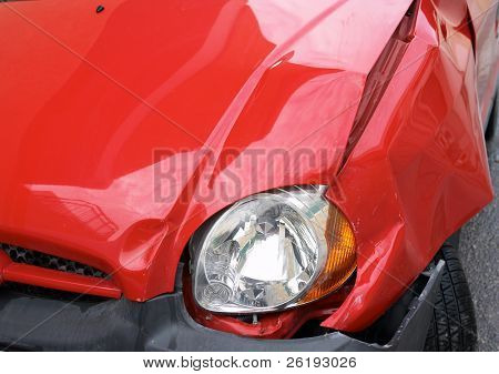 Crumpled wing of a small car after an accident