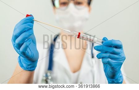 Test For Coronavirus Covid-19. Female Doctor Or Nurse Doing Lab Analysis Of A Nasal Swab In A Hospit