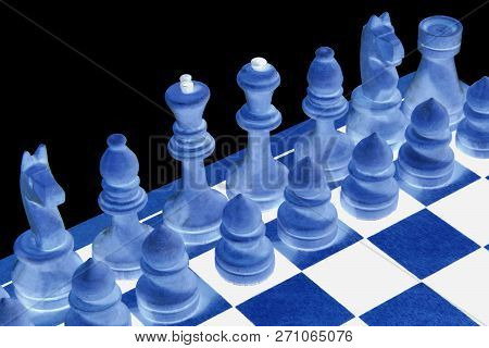 Abstraction. Chessboard With Figures On A Black Background. Game For The Mind And The Development Of