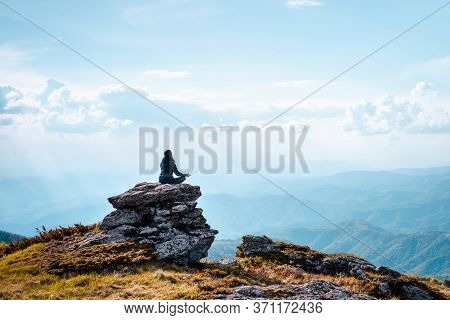 Woman Doing Yoga In Nature. Yoga In Nature. Yoga Lifestyle. Healthy Lifestyle. Woman Doing Yoga On M